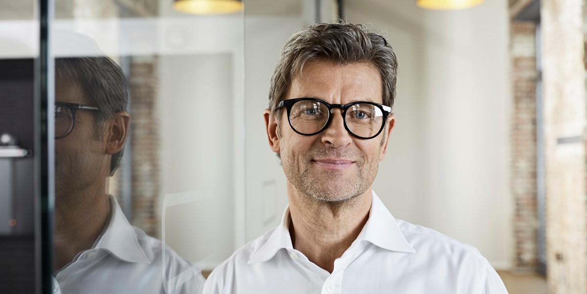 man in office, smiling