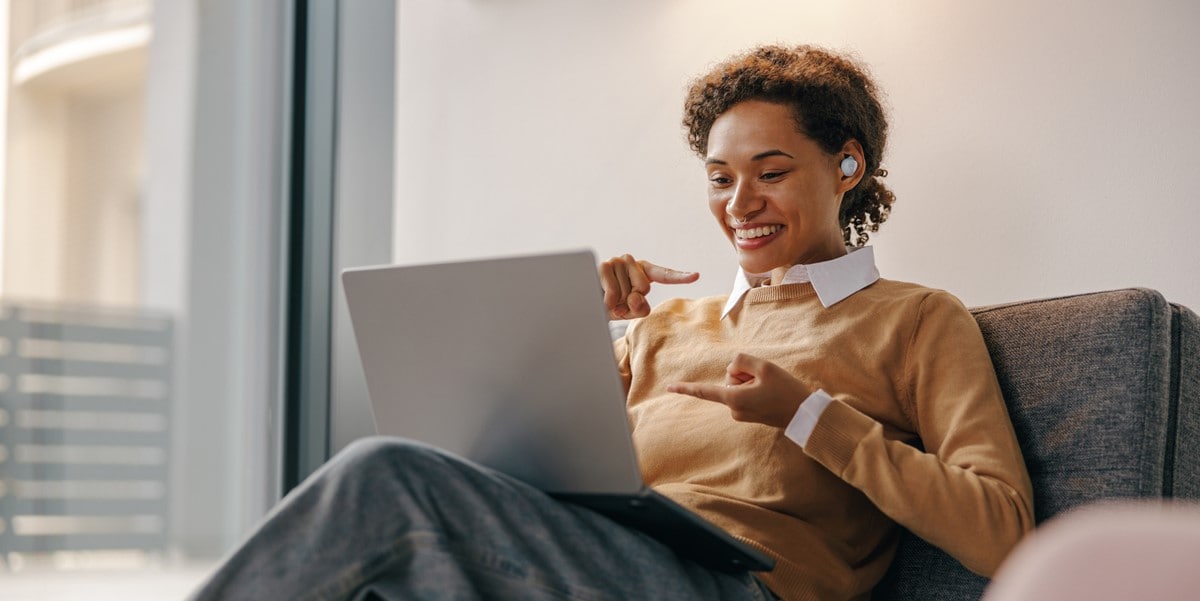 professional attending virtual meeting on laptop